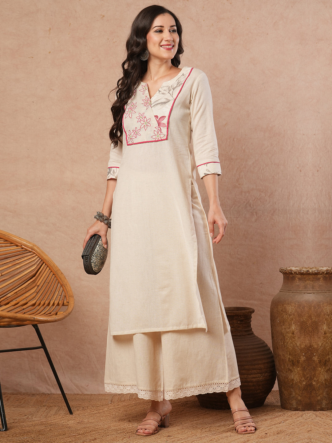 Straight fit solid kurta with a wrap half embroidered and half printed yoke.