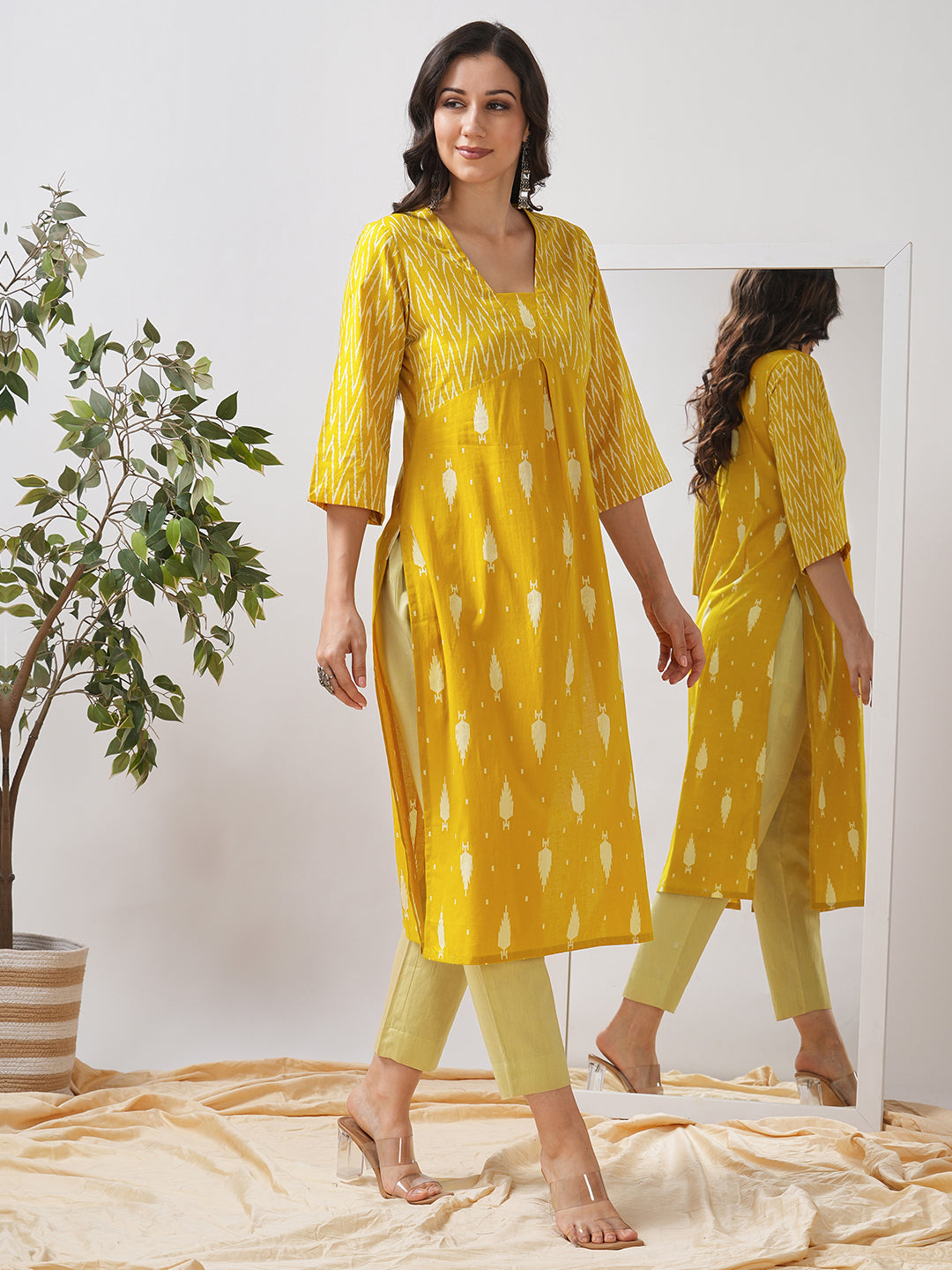 Straight fit shaped waist kurta with coordinated print yoke and bell sleeves.