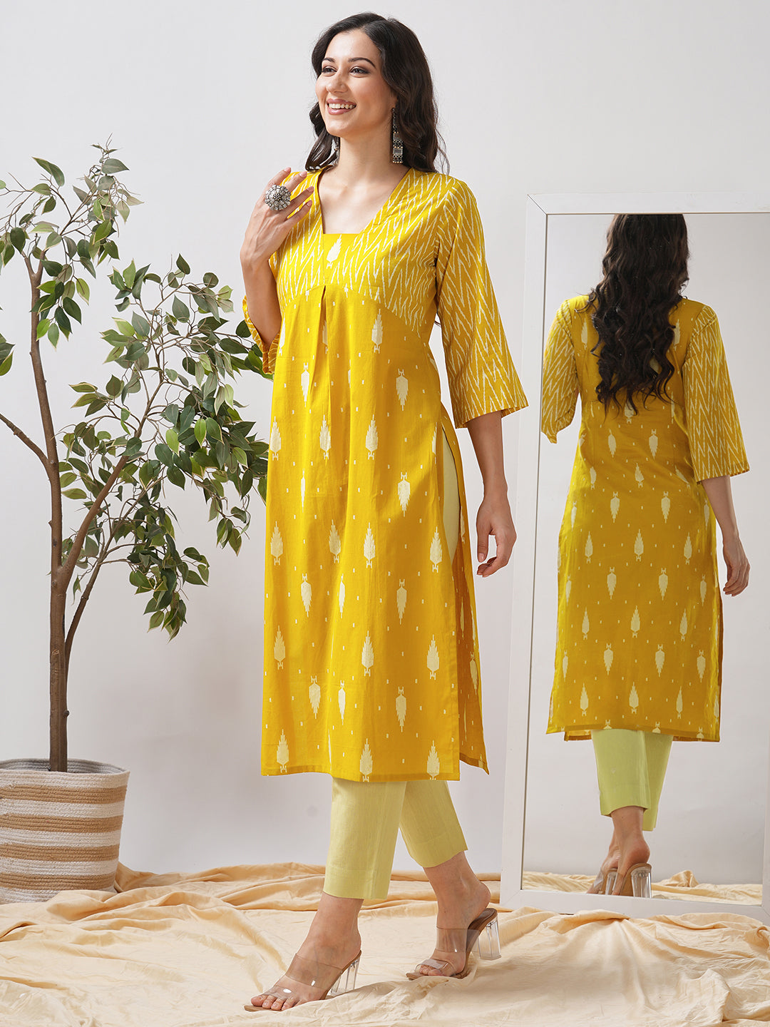 Straight fit shaped waist kurta with coordinated print yoke and bell sleeves.