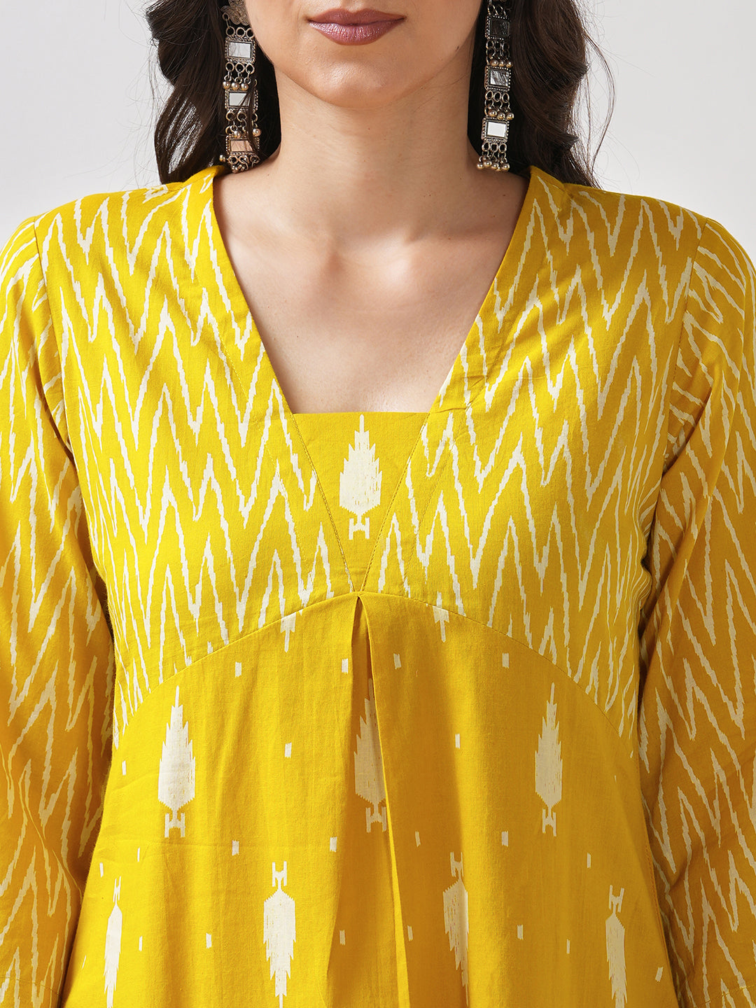 Straight fit shaped waist kurta with coordinated print yoke and bell sleeves.