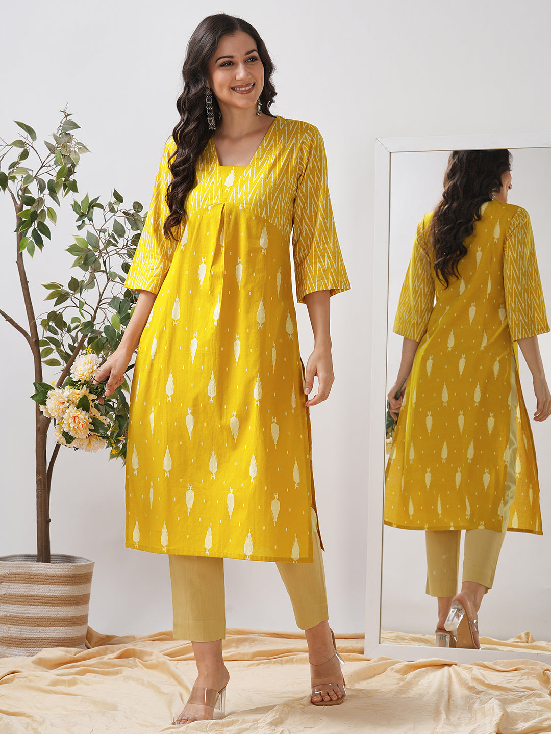 Straight fit shaped waist kurta with coordinated print yoke and bell sleeves.