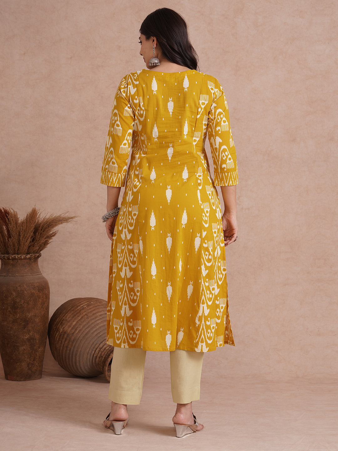 A-Line shoulder princess kurta with coordinating prints and handwork around placket.