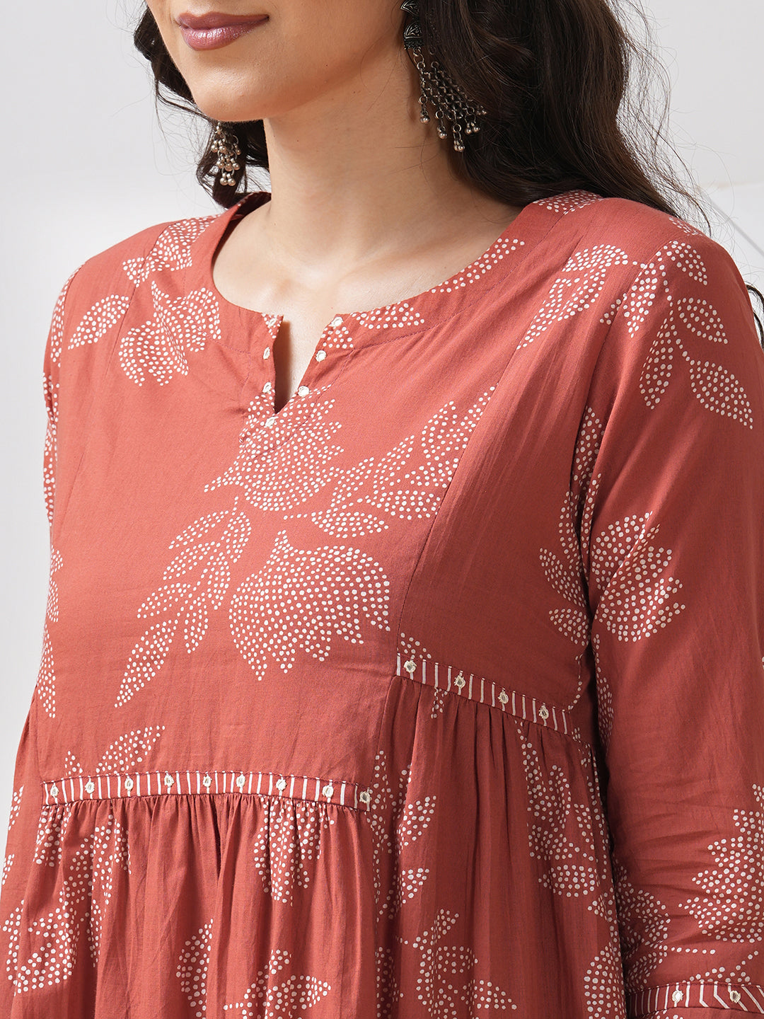 Printed flared kurta with layered waist gathers and trim detailing with handwork mirrors.