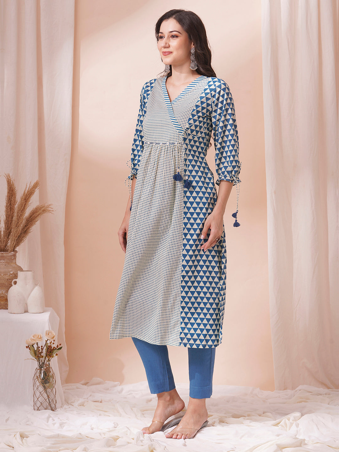 Gathered A-line kurta with overlapping yoke and gathered tie-up sleeves.