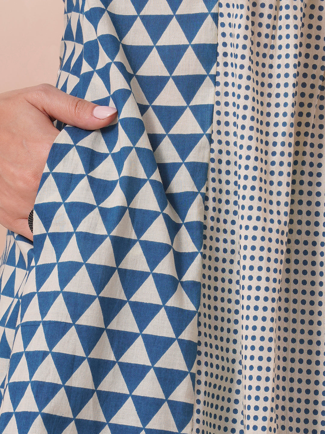 Gathered A-line kurta with overlapping yoke and gathered tie-up sleeves.