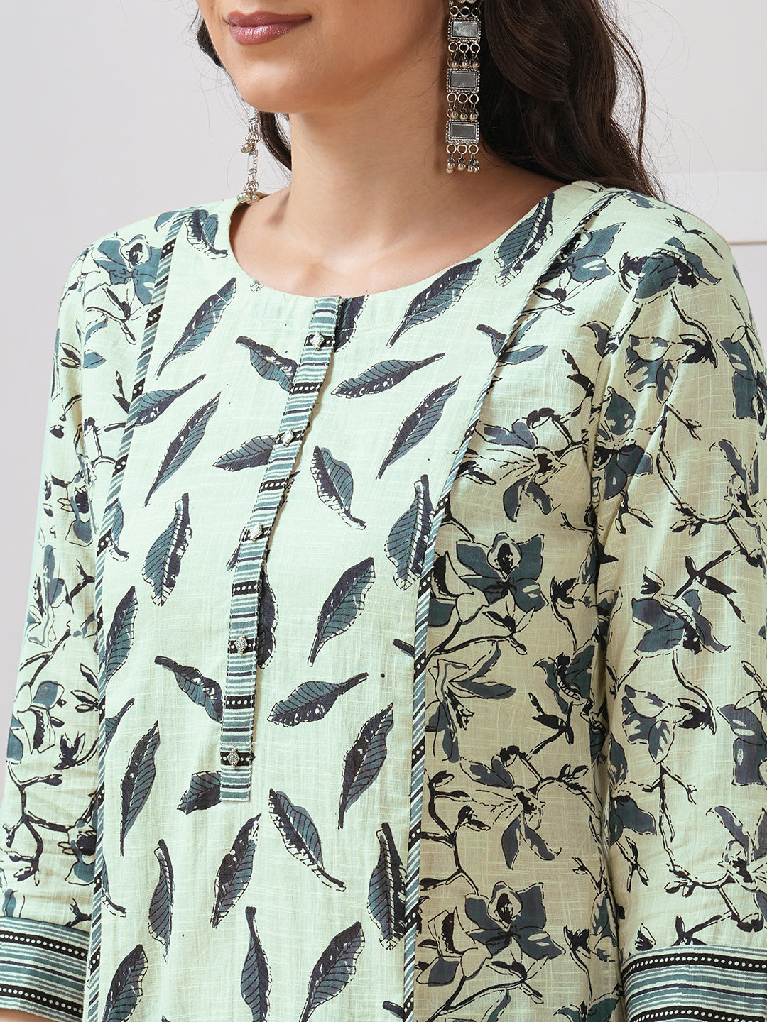 Straight fit shoulder princess kurta with piping between the seams and placket.