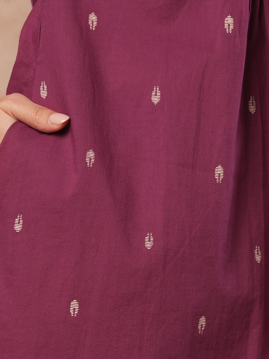 A-line block printed cotton kurta with mirror work paired printed palazzo.