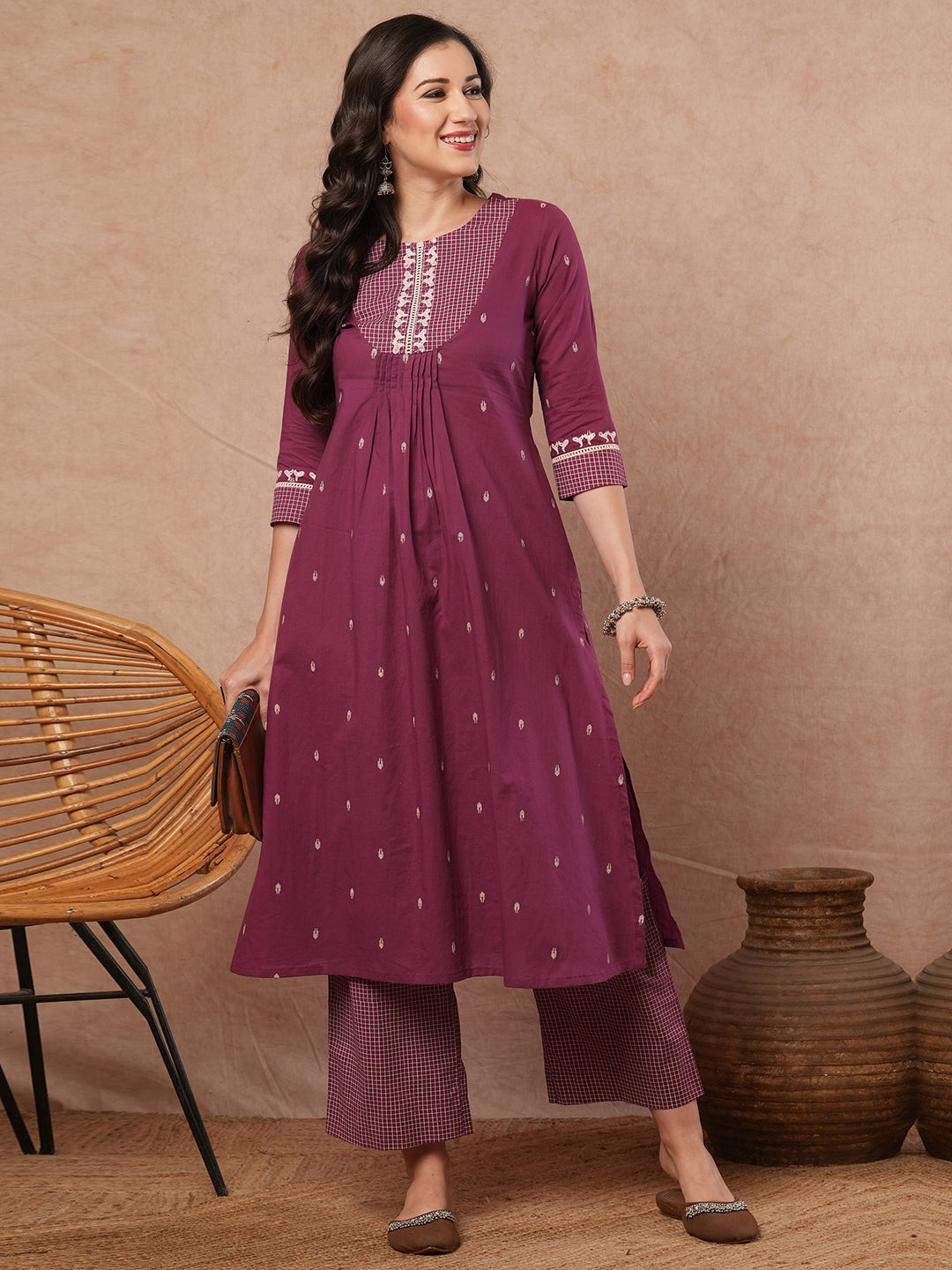 A-line block printed cotton kurta with mirror work paired printed palazzo.