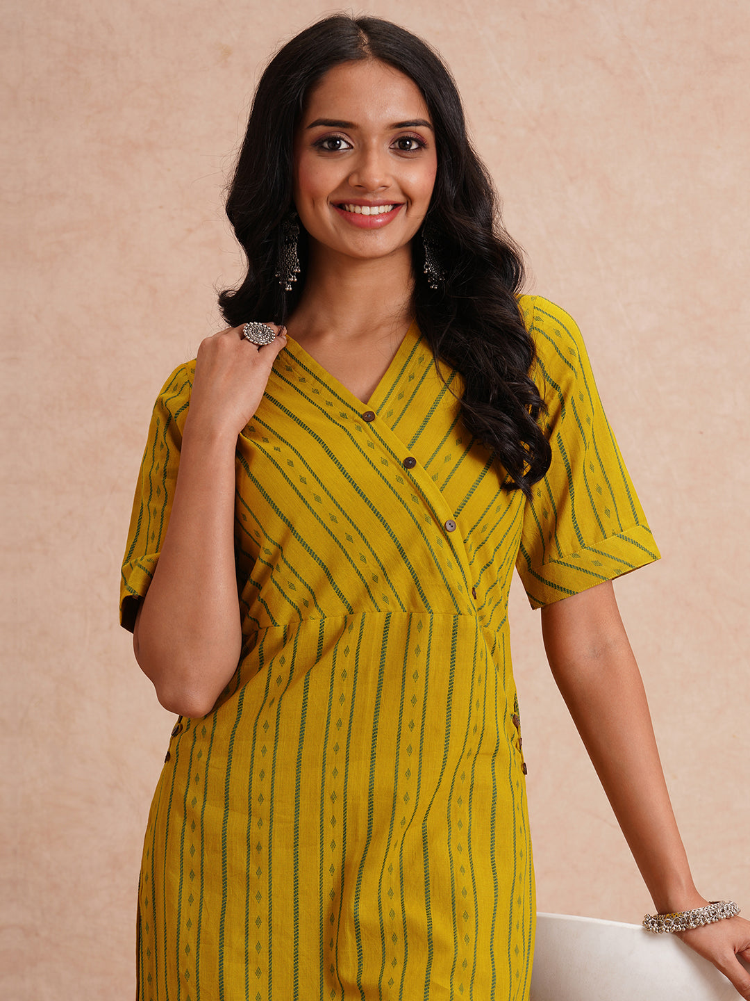 Straight fit kurta set with half sleeves and button detailing paired with plain palazzo.