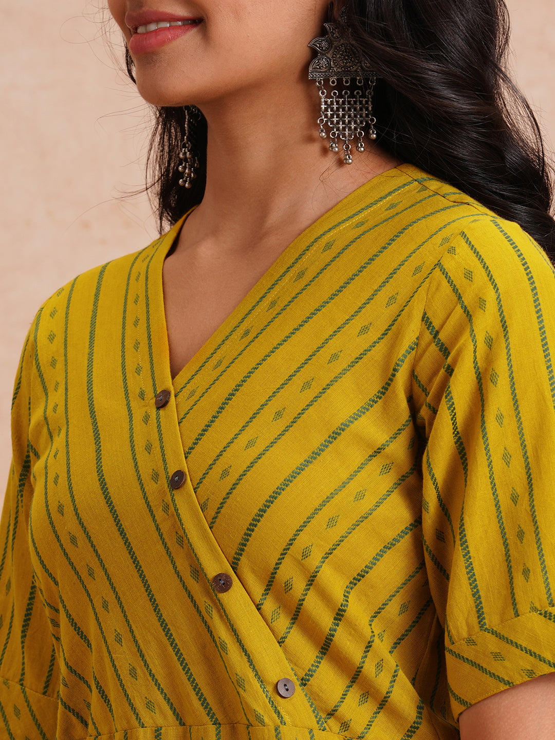 Straight fit kurta set with half sleeves and button detailing paired with plain palazzo.