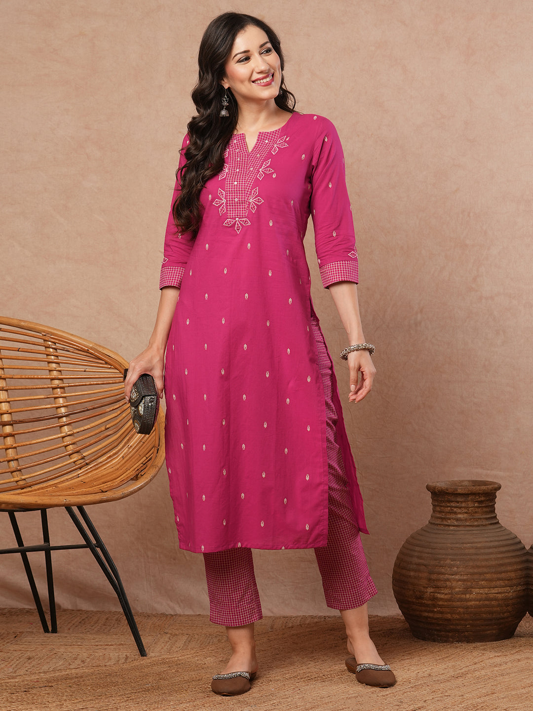 Straight fit kurta set with contrast trim fabric and applique on neck and sleeves.