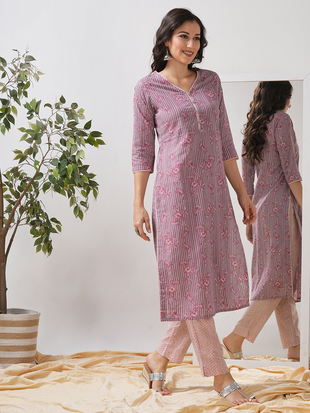 Straight kurta set with piping detailing on neck, sleeves and side slits paired with pant.