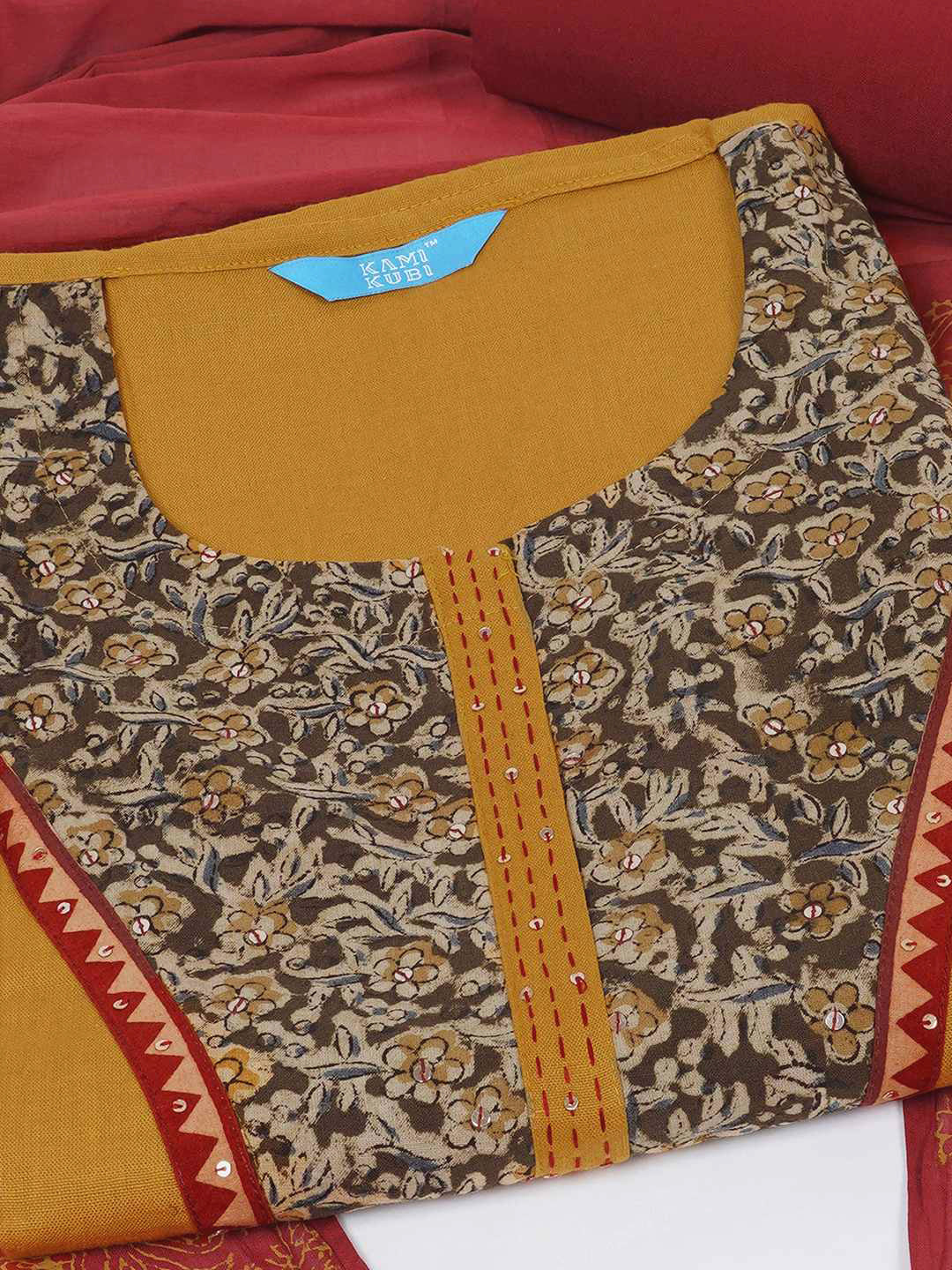 3-piece unstitched set with intricate floral patterns, paired with a contrasting black dupatta & plain bottom.(Yellow)