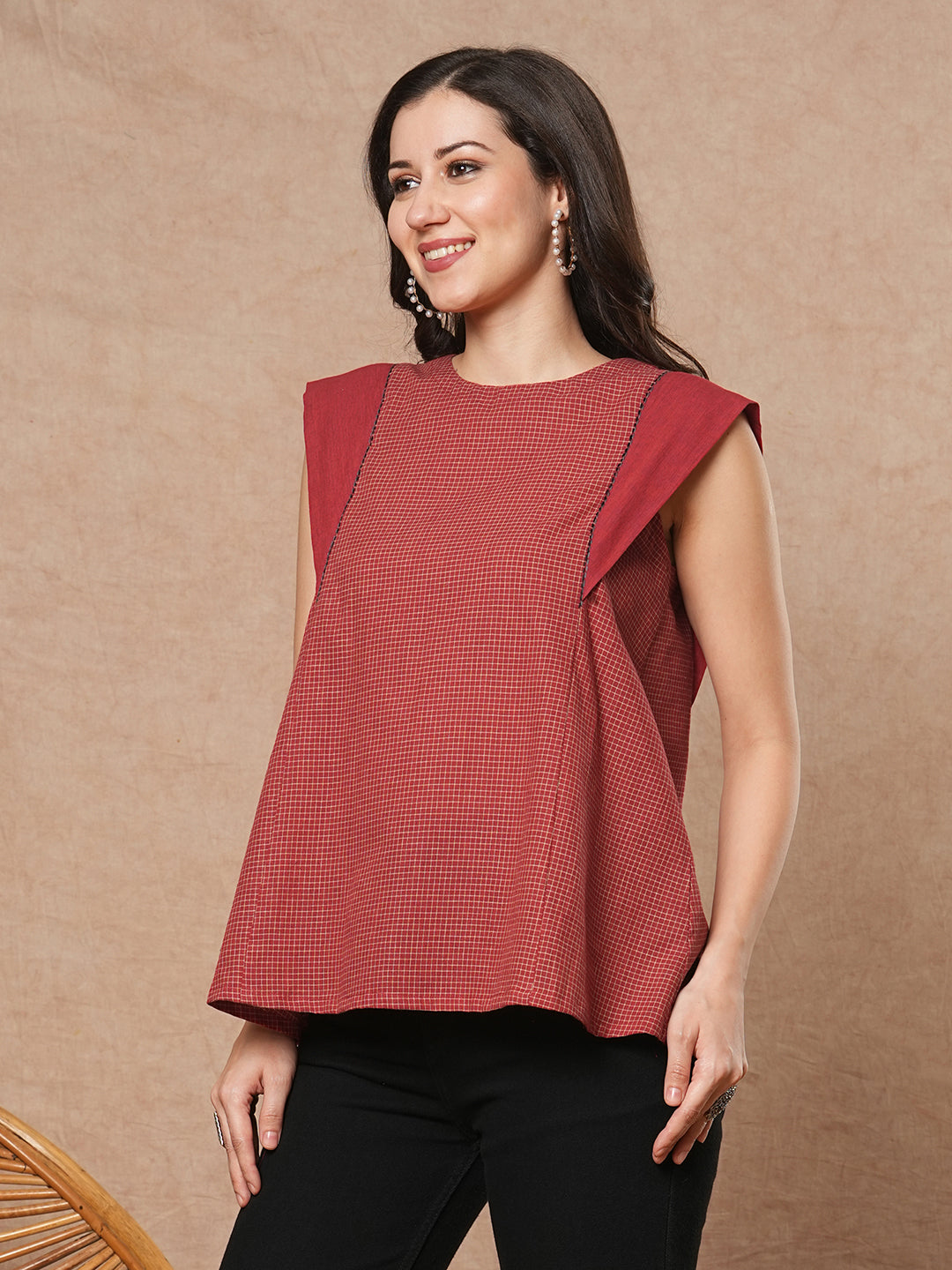 Flared top in chequered cotton fabric with hand embroidered running stitch