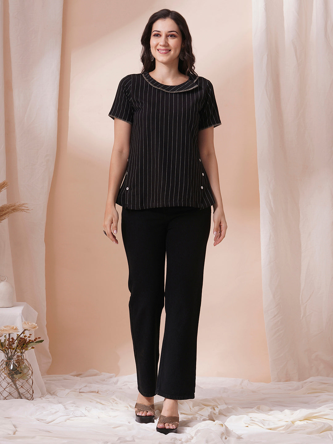 Striped cotton top with constructed collar and button detailing with hand embroidery.