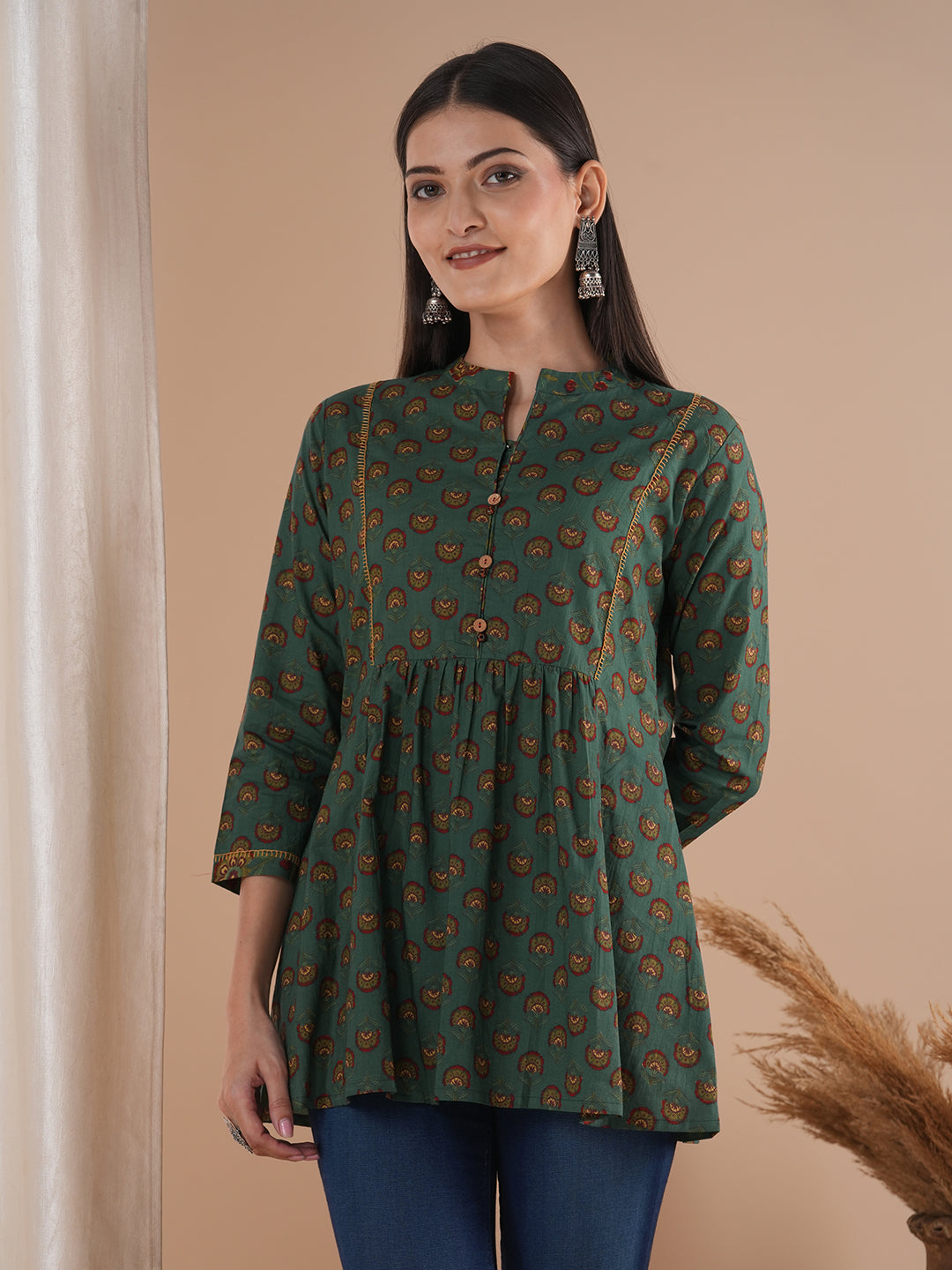 Gathered tunic in cotton print with hand embroidered feather stitch