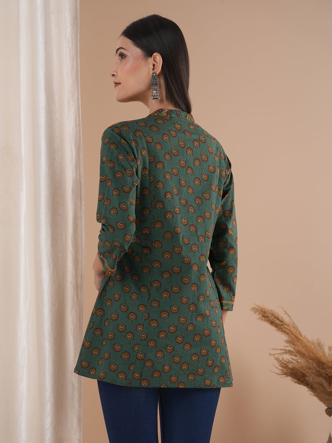 Gathered tunic in cotton print with hand embroidered feather stitch