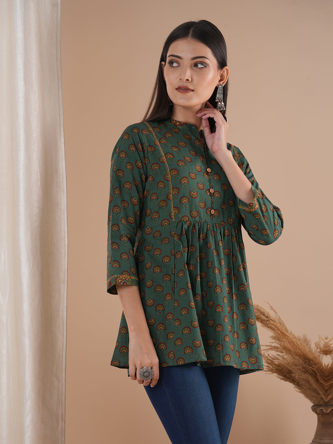 Gathered tunic in cotton print with hand embroidered feather stitch