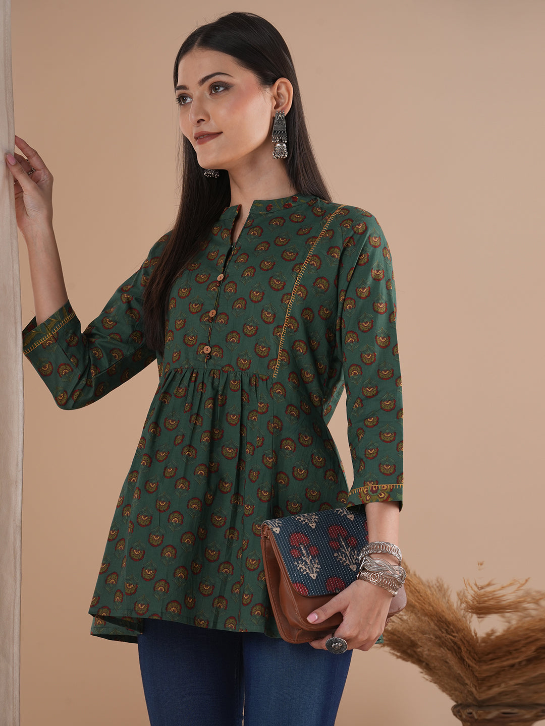 Gathered tunic in cotton print with hand embroidered feather stitch