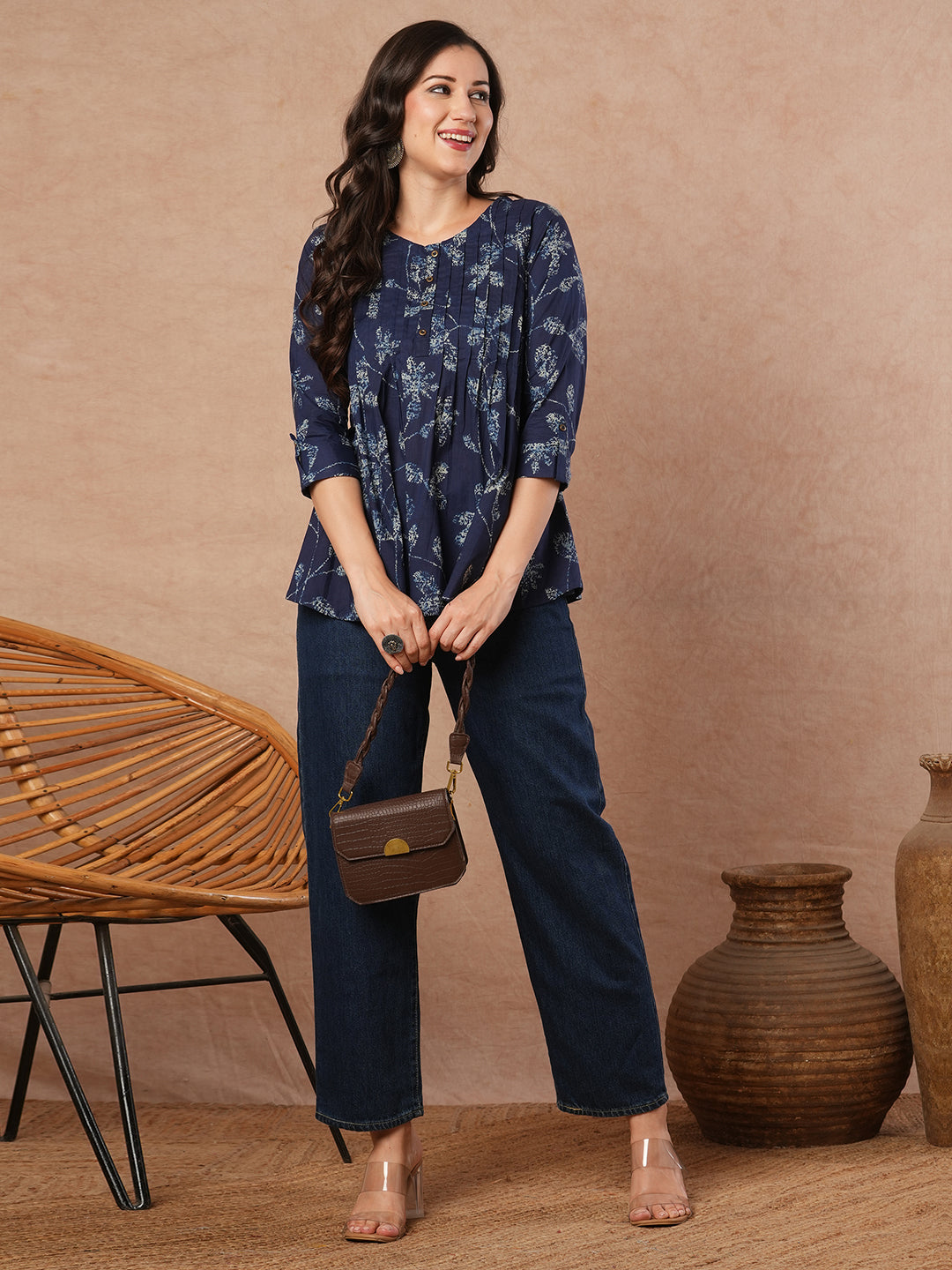 Pleated cotton print top with loop and button detailing on sleeve.