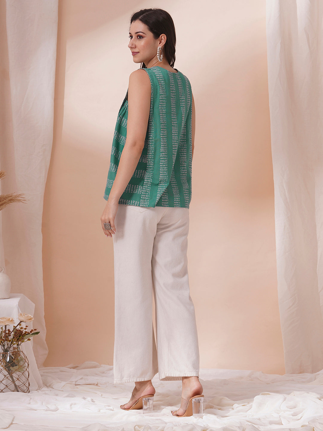 Printed flex sleeveless top with center pleat and elasticated gathers.