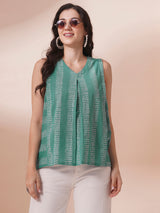 Printed flex sleeveless top with center pleat and elasticated gathers.