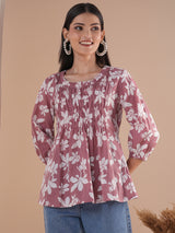 A short top with gathered centre panel and elasticated sleeves