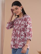A short top with gathered centre panel and elasticated sleeves