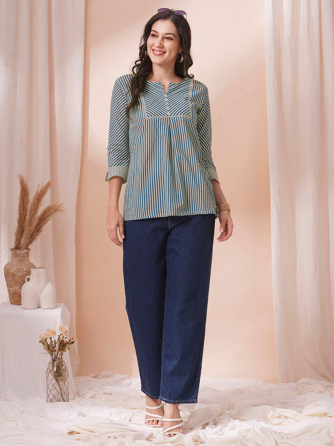 Striped top with mitered yoke and sleeves with polka border and cuff.