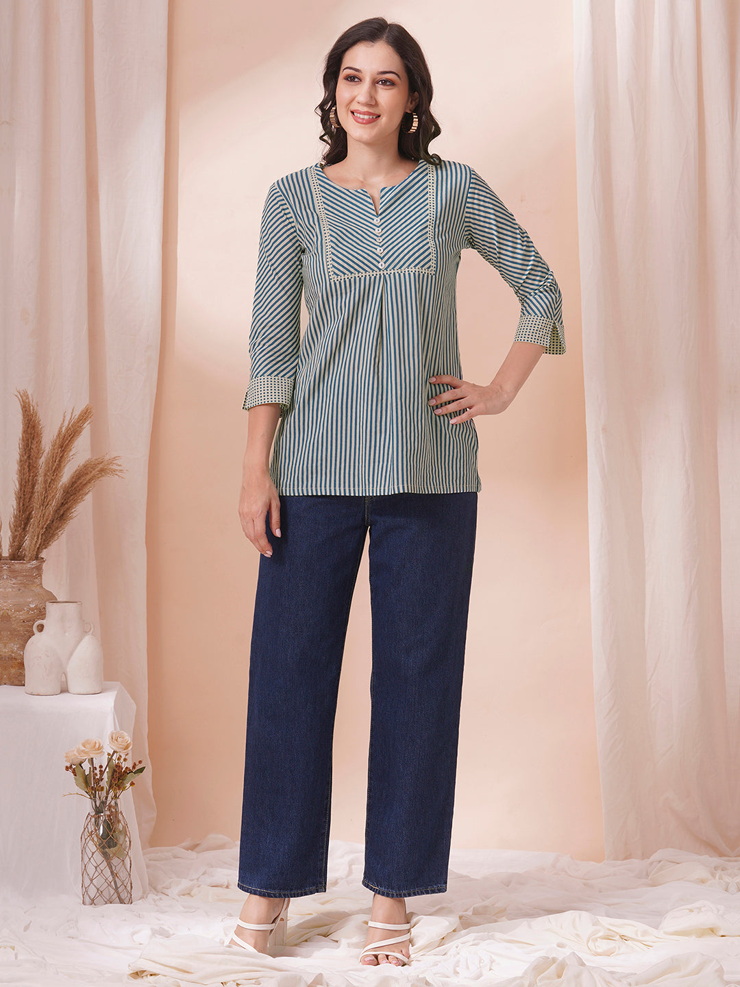 Striped top with mitered yoke and sleeves with polka border and cuff.