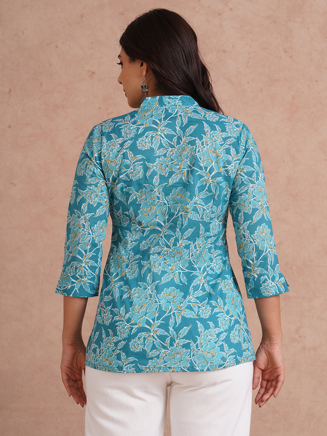 Printed top with knife pleat detailing and a V-neckline.