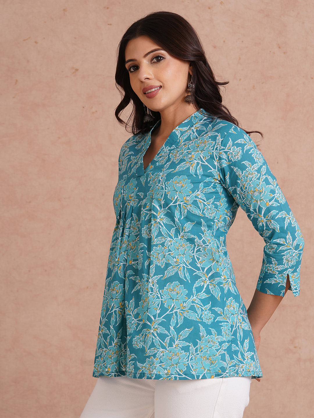 Printed top with knife pleat detailing and a V-neckline.