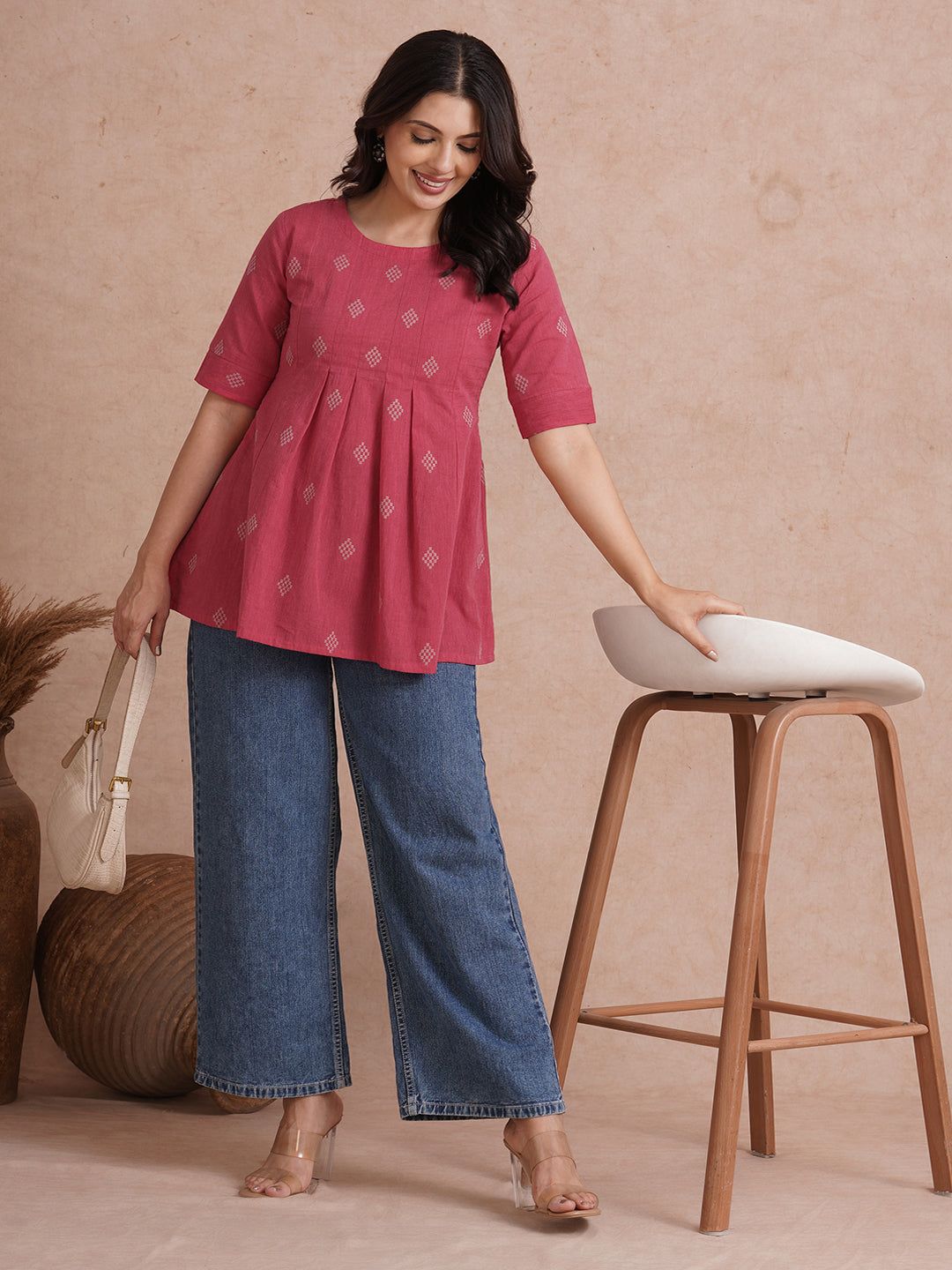 Pleated top with dobby fabric panels and elbow sleeves.