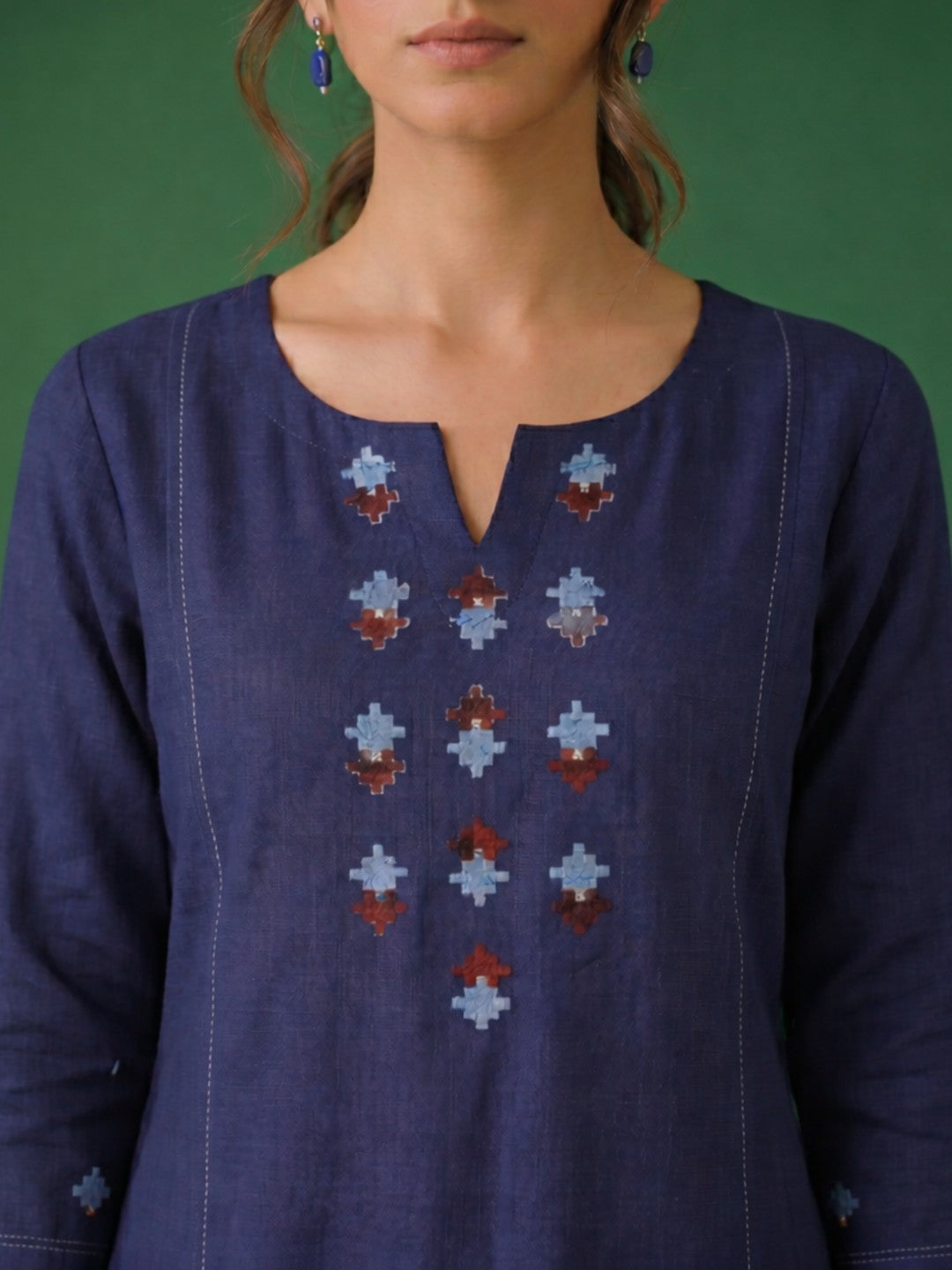 Straight fit cotton slurb kurta with shoulder princess Pannel, hand block print and sequin work.