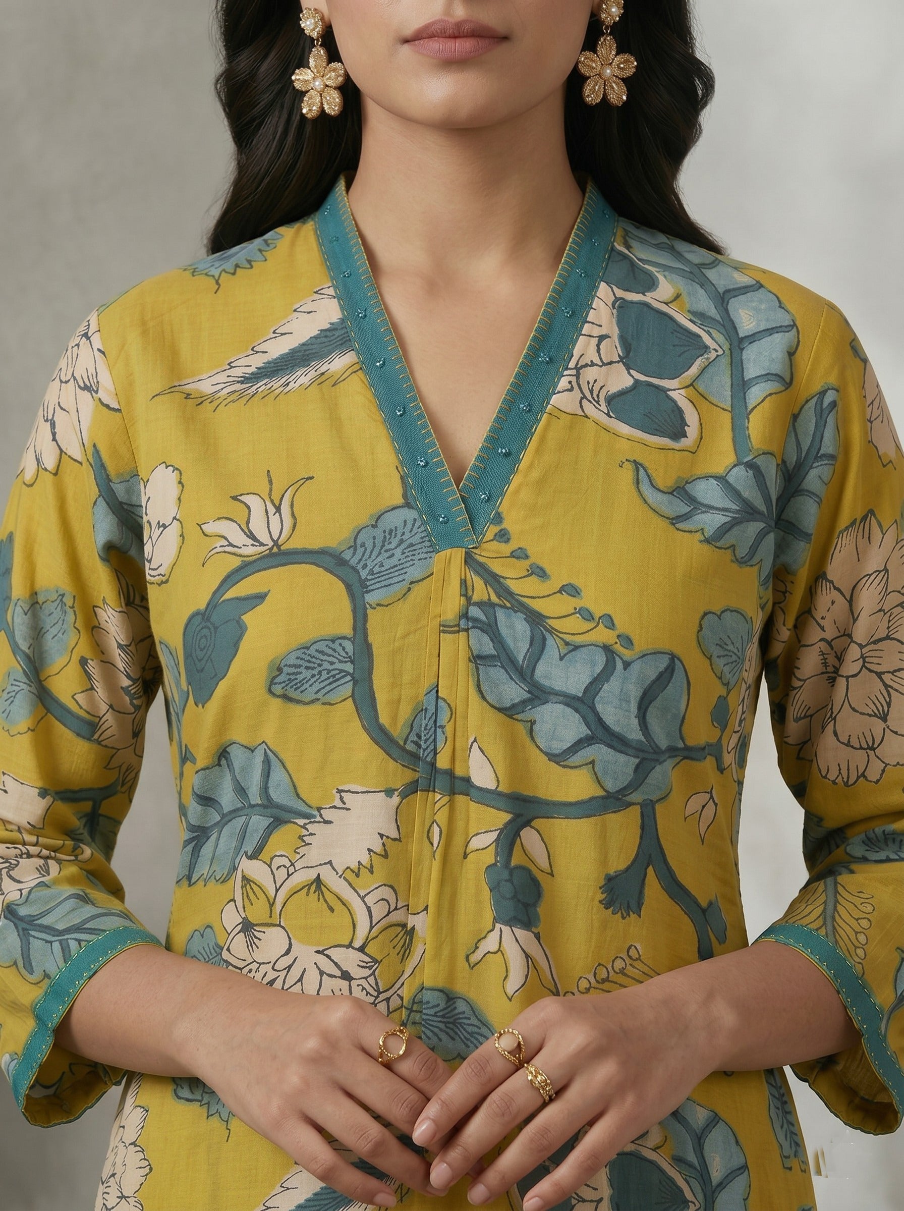 Mustard Floral Printed A-Line Cotton Kurta with Elegant V-Neck Mirror Detailing.