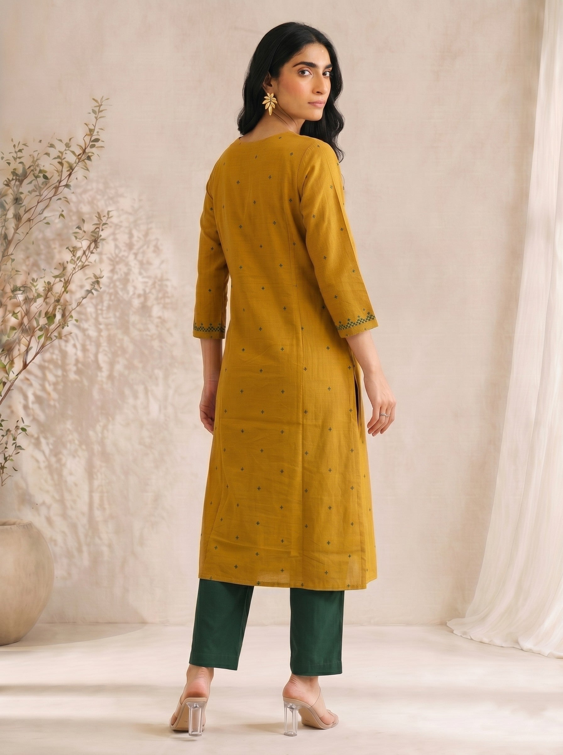 Straight fit cotton dobby kurta with tucks and block print on front and sleeves.