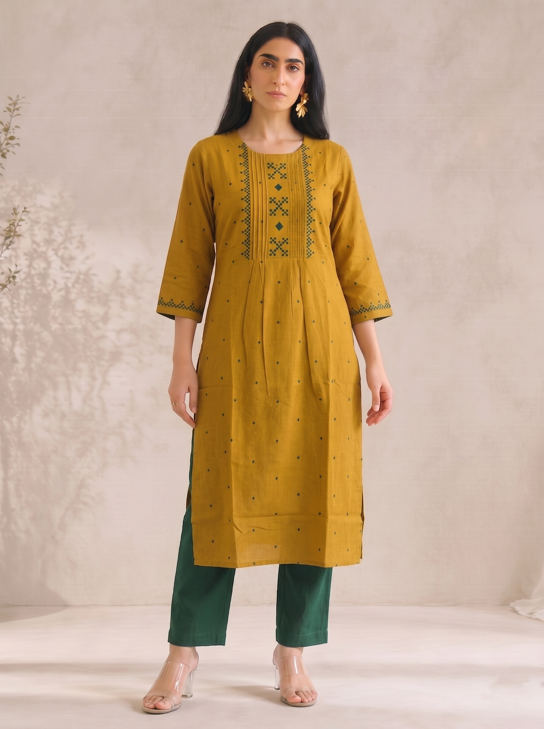 Straight fit cotton dobby kurta with tucks and block print on front and sleeves.