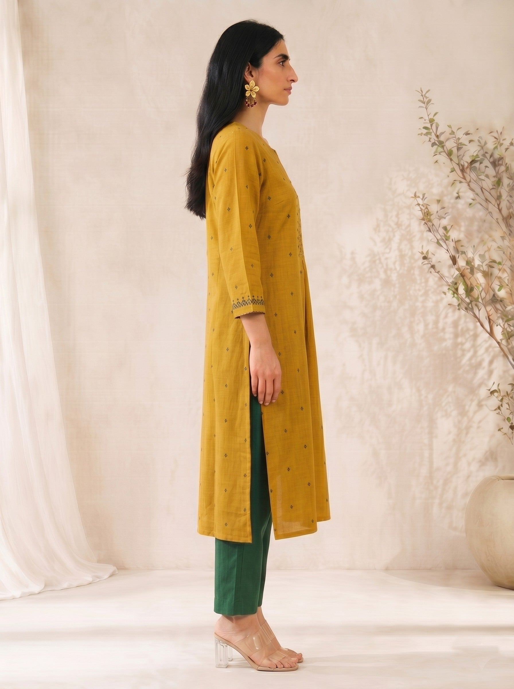 Straight fit cotton dobby kurta with tucks and block print on front and sleeves.