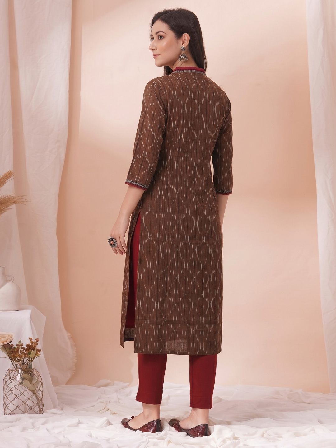 Straight Fit Ikat Kurta with Featuring Woven Stripes, Handwork & Solid Trim.