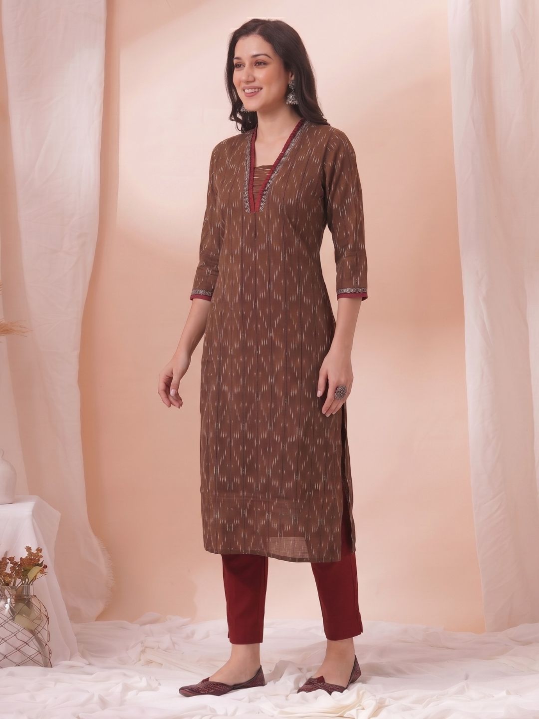 Straight Fit Ikat Kurta with Featuring Woven Stripes, Handwork & Solid Trim.