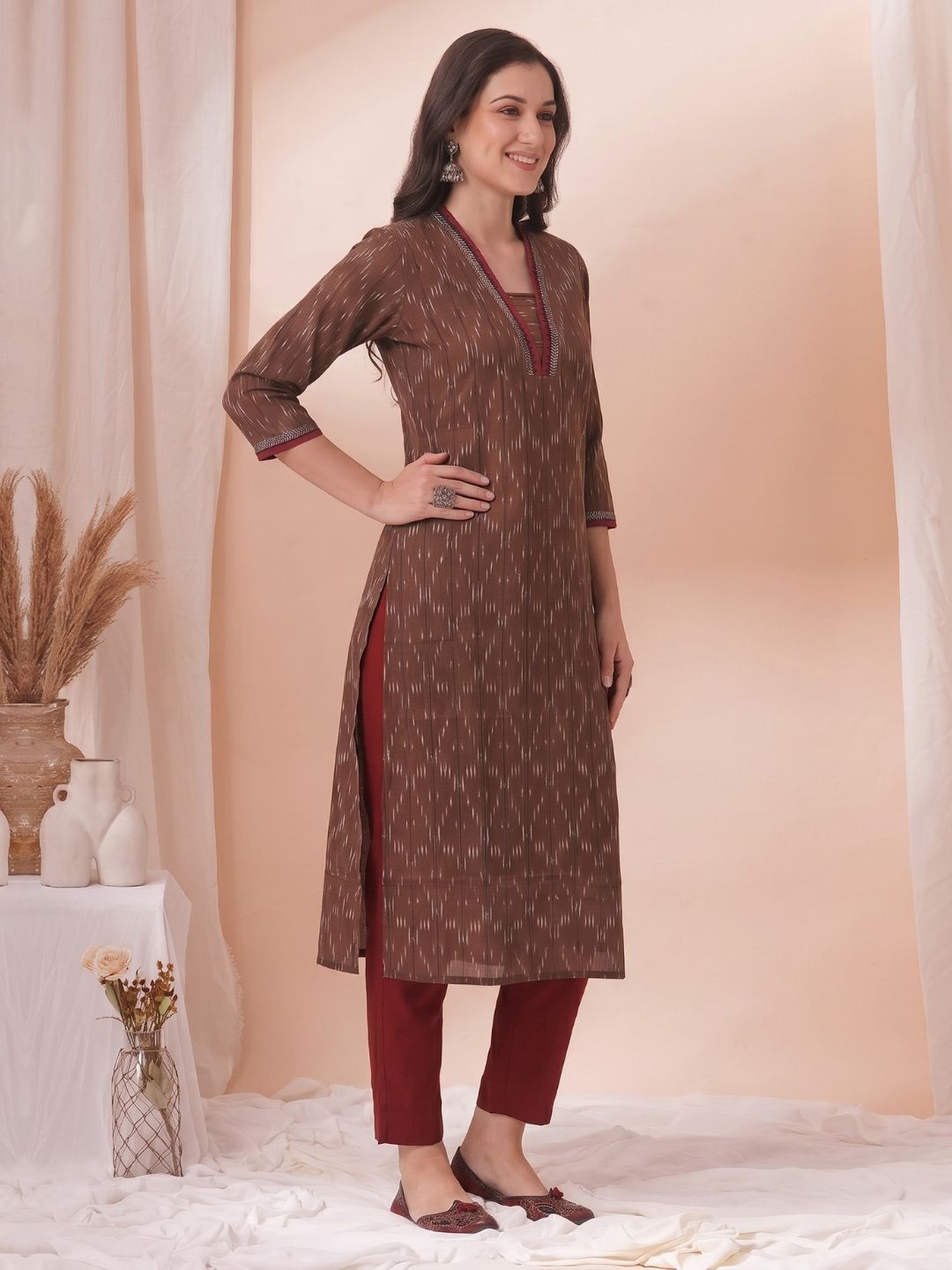 Straight Fit Ikat Kurta with Featuring Woven Stripes, Handwork & Solid Trim.