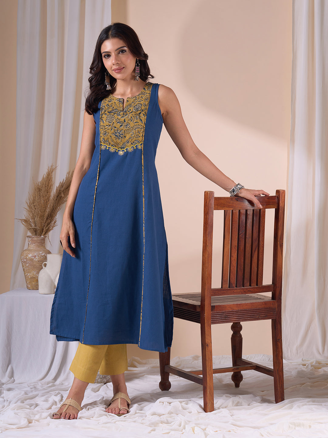 A-Line Sleeveless Kalamkari Cutwork Yoke Cotton Kurta with Contrast Piping.