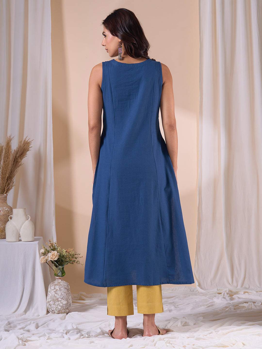 A-Line Sleeveless Kalamkari Cutwork Yoke Cotton Kurta with Contrast Piping.