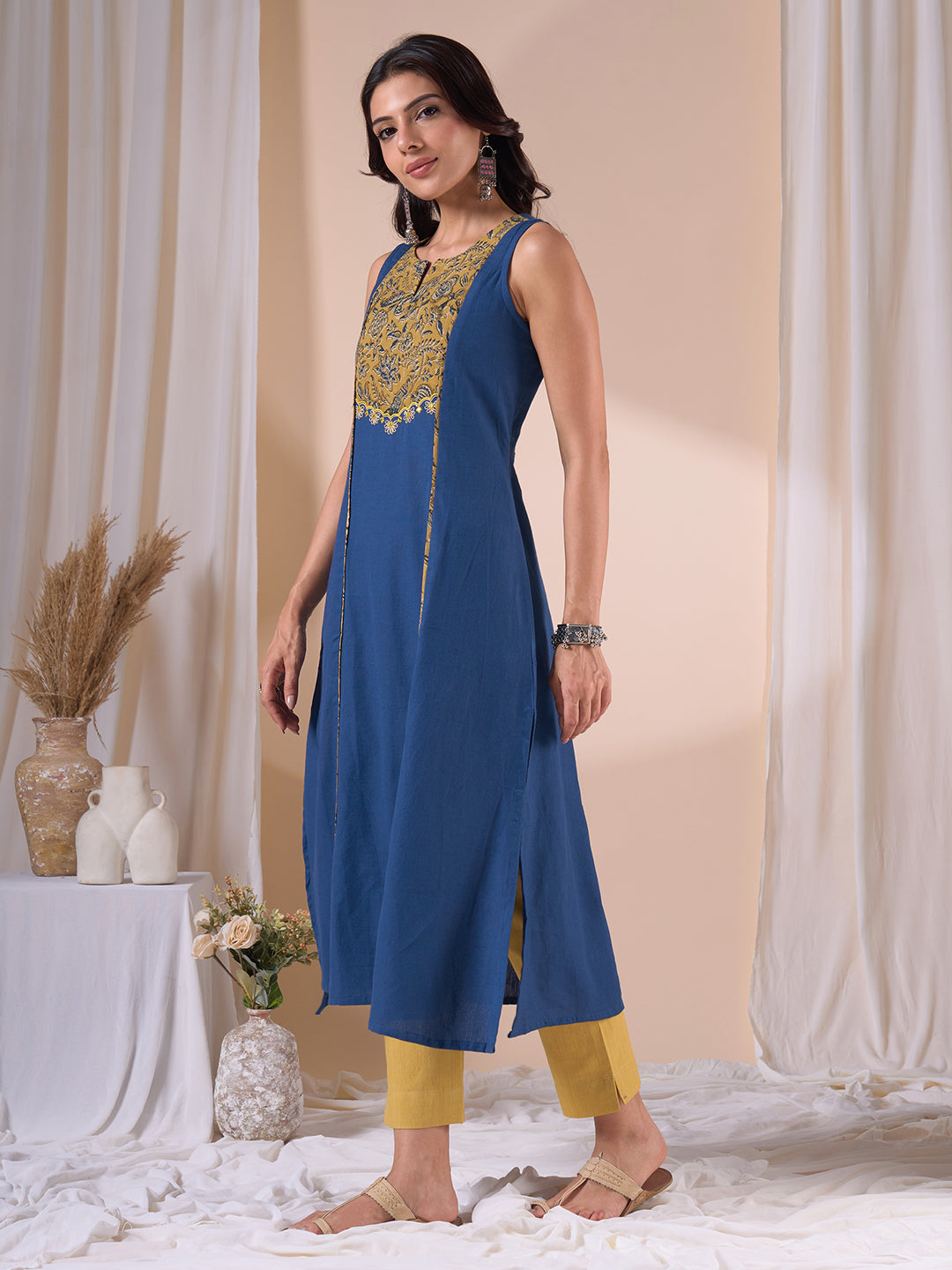 A-Line Sleeveless Kalamkari Cutwork Yoke Cotton Kurta with Contrast Piping.