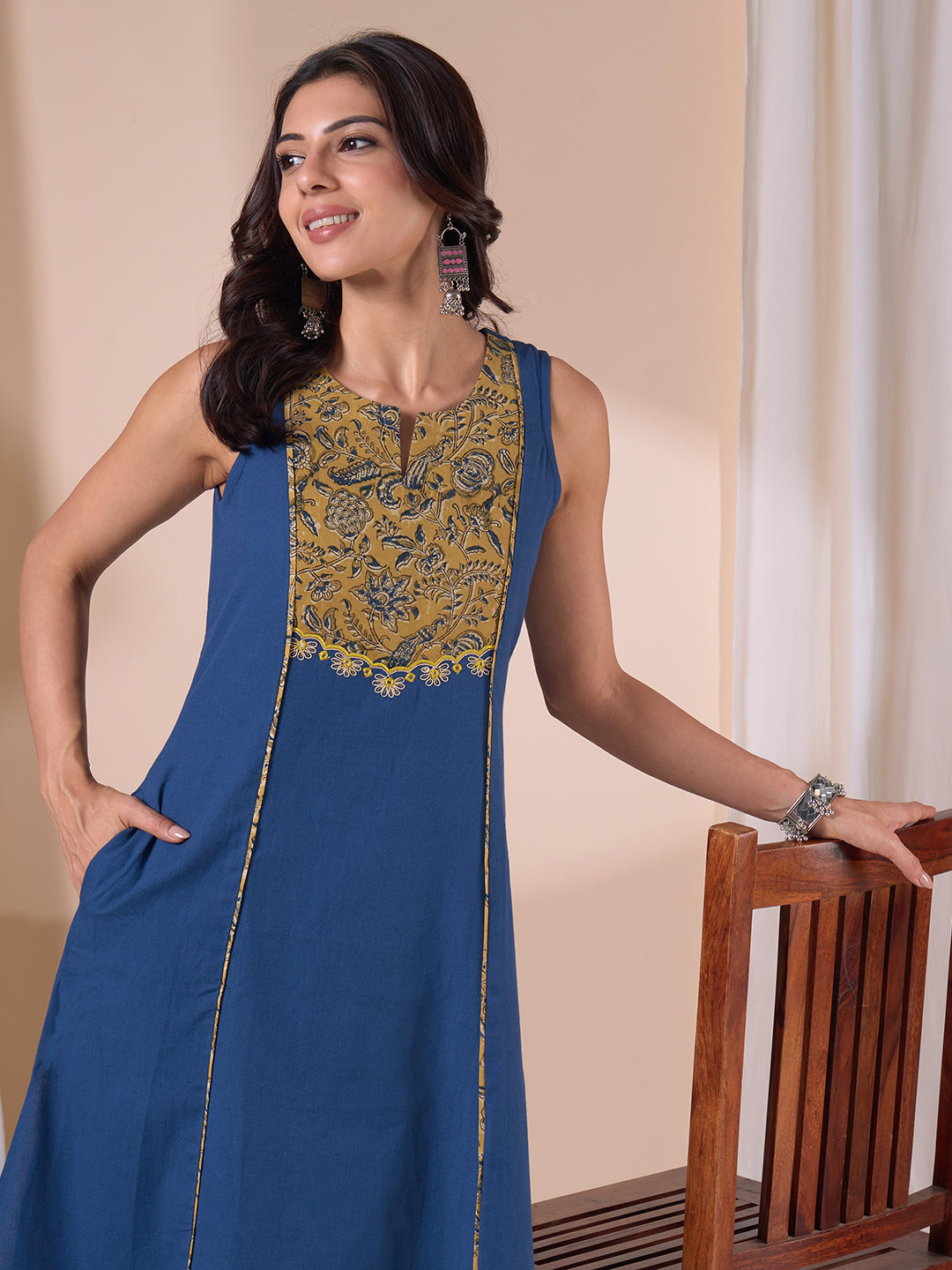 A-Line Sleeveless Kalamkari Cutwork Yoke Cotton Kurta with Contrast Piping.