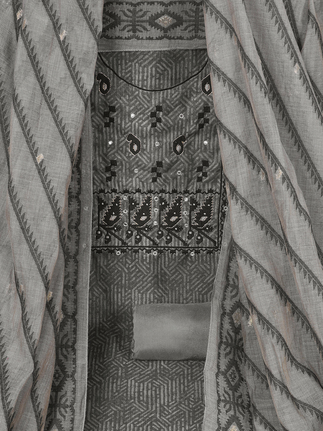 Elegant unstitched dress material in premium Chanderi fabric with ethnic motifs and handwork accents.