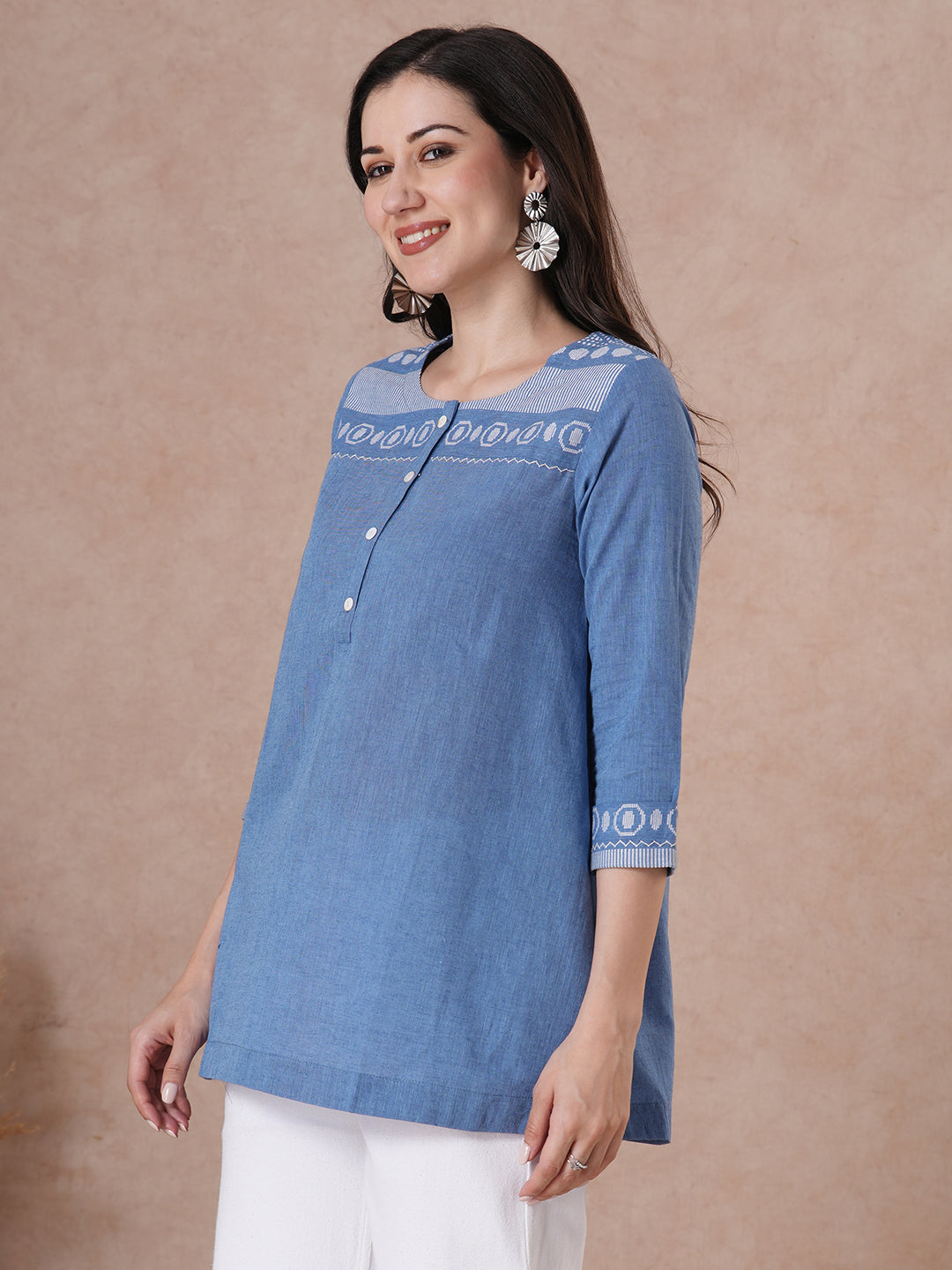 Woven cotton dobby tunic in light pink shade with hand embroidery.