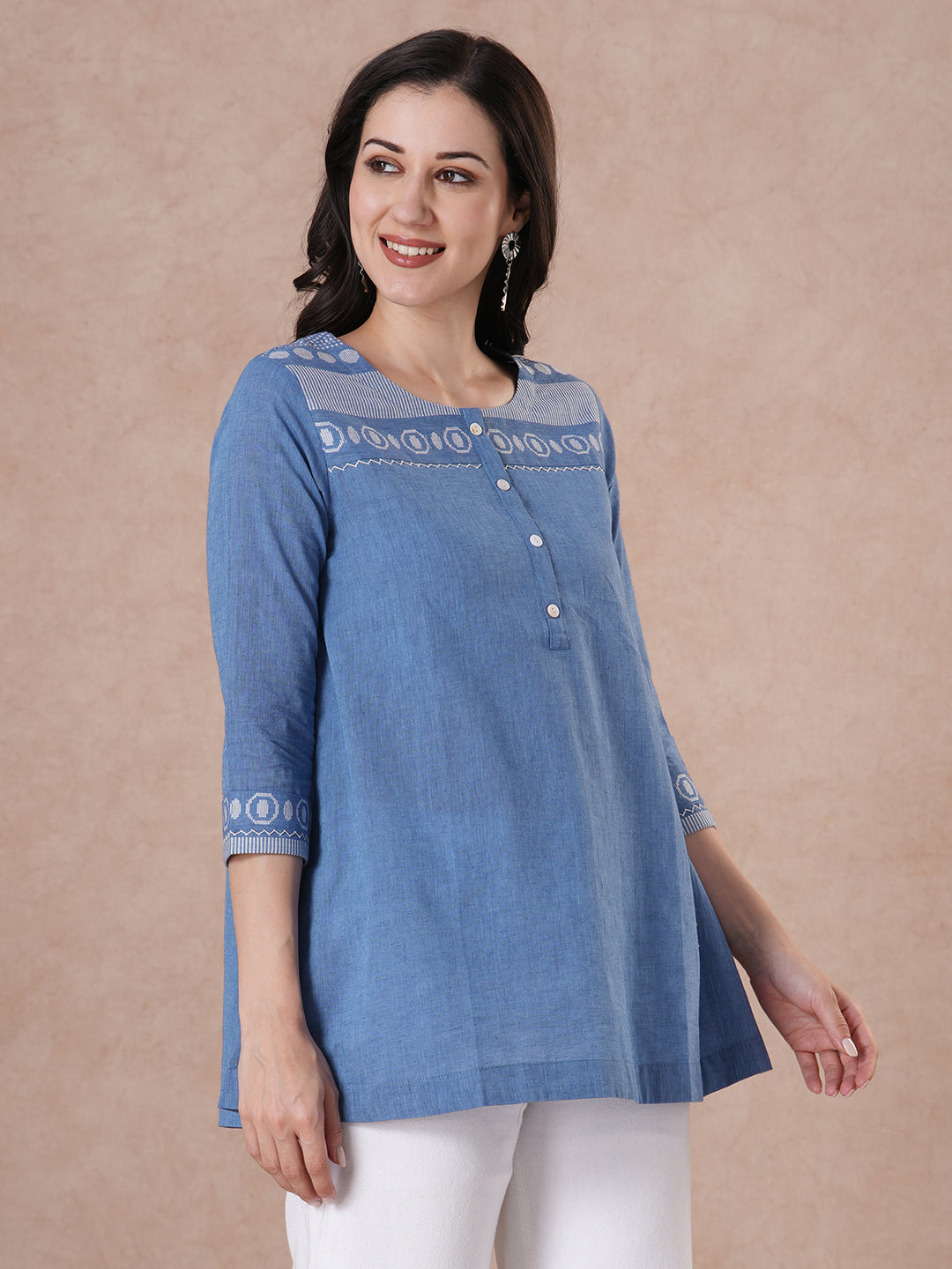 Woven cotton dobby tunic in light pink shade with hand embroidery.