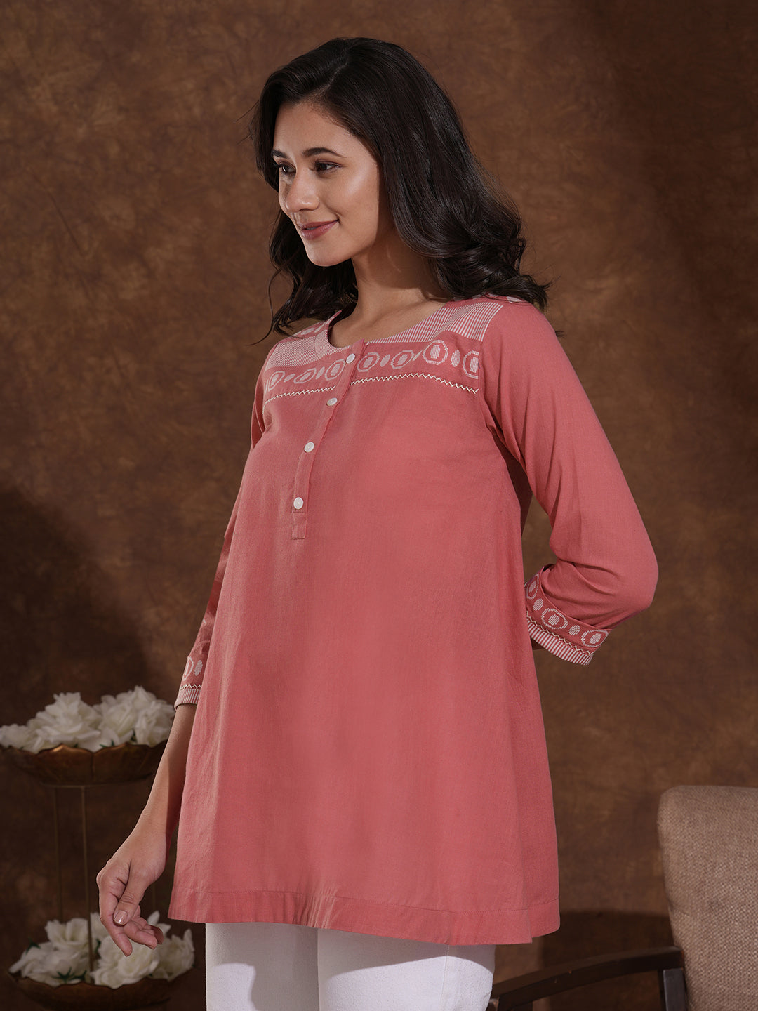 Woven cotton dobby tunic in light pink shade with hand embroidery.