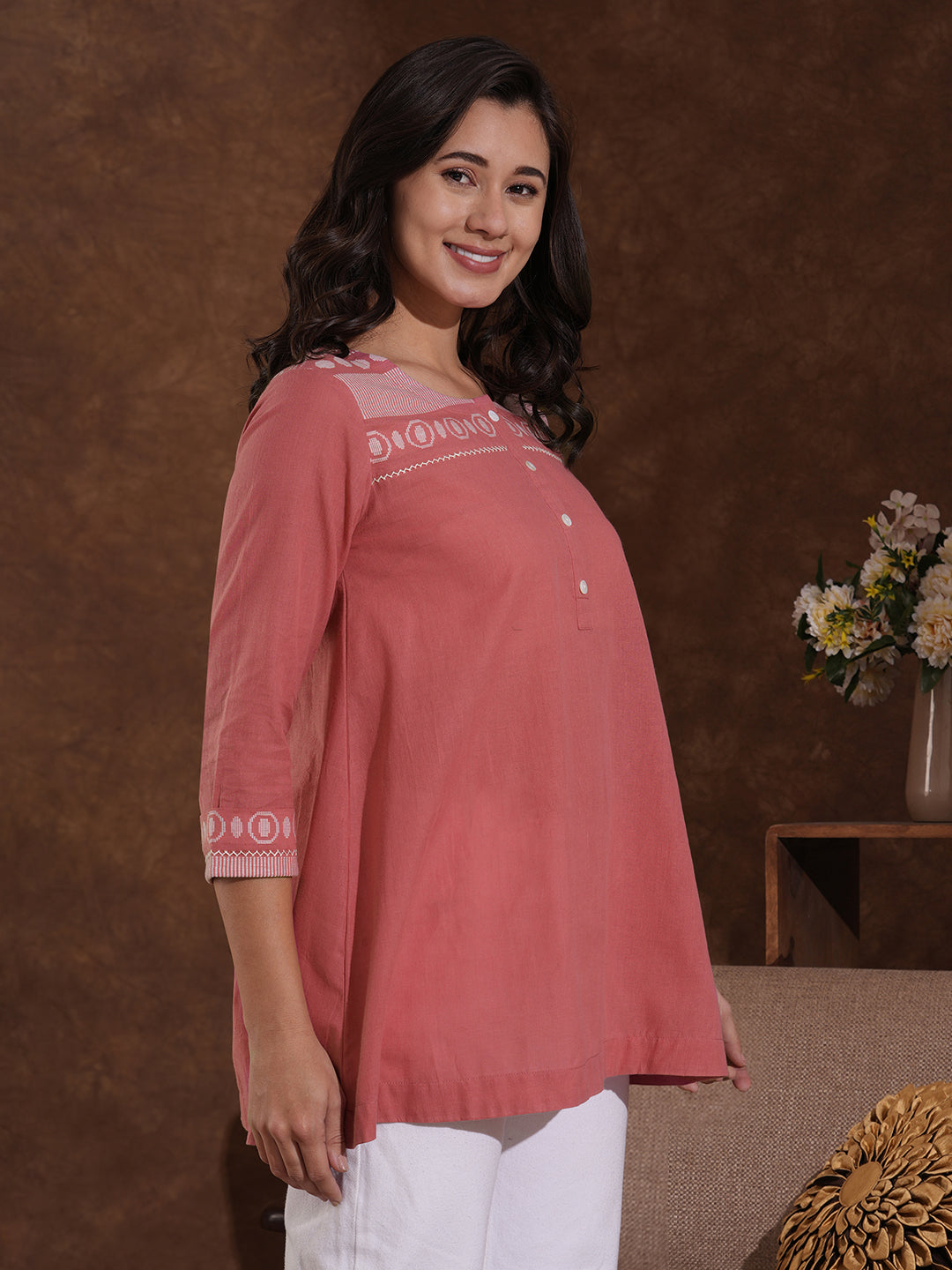 Woven cotton dobby tunic in light pink shade with hand embroidery.
